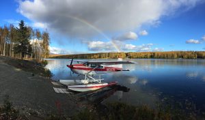 Beautiful rainbow appears behind Visnaw Lake and C-185